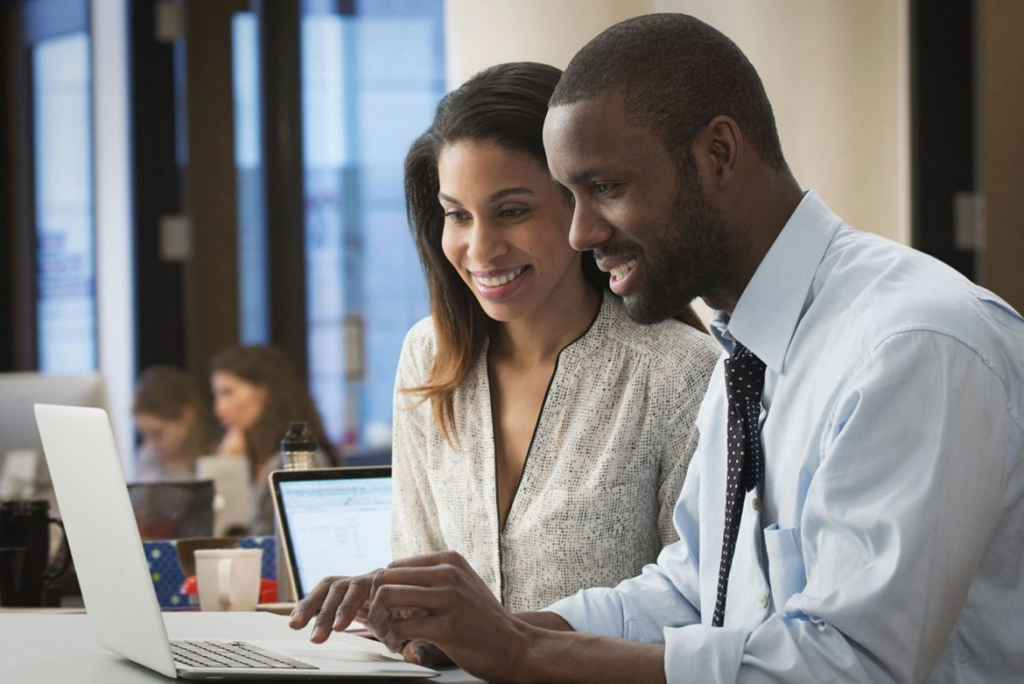 business people using laptop in office 1170x781 1